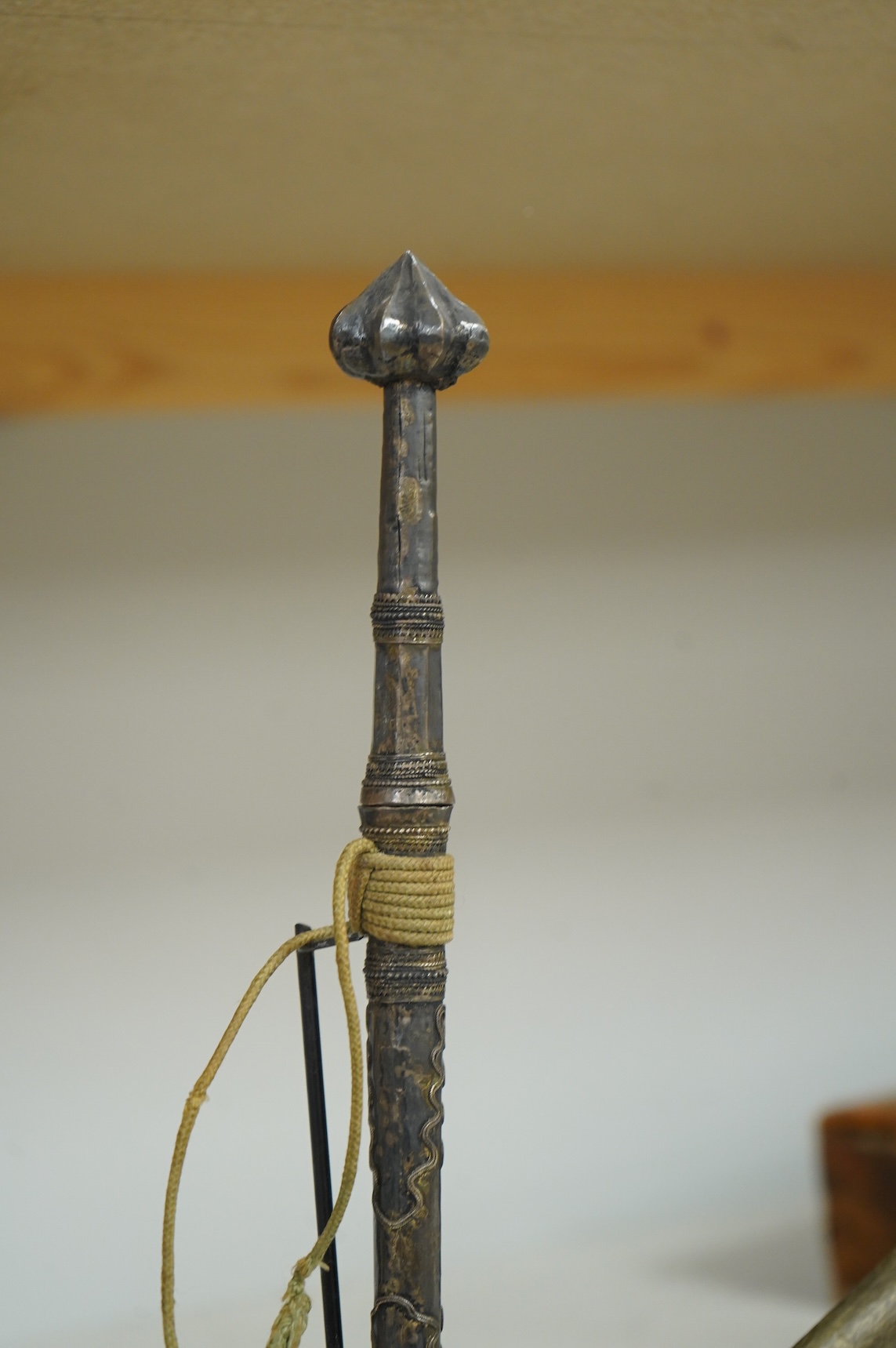A Burmese dagger dha, blade 14.5cm, hilt and sheath covered in sheet silver filigree decoration, together with an unusual pair of small Burmese knives with silver mounted stag horn handles and silver covered sheath, both
